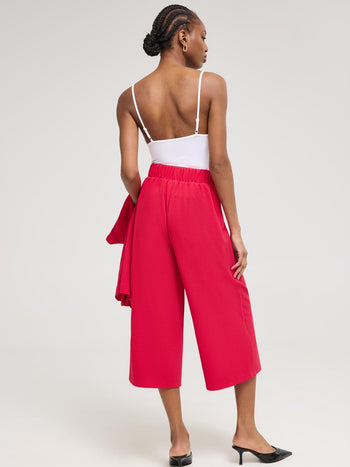 Pantalon gaucho à jambes larges et détails boutonnés Rose
