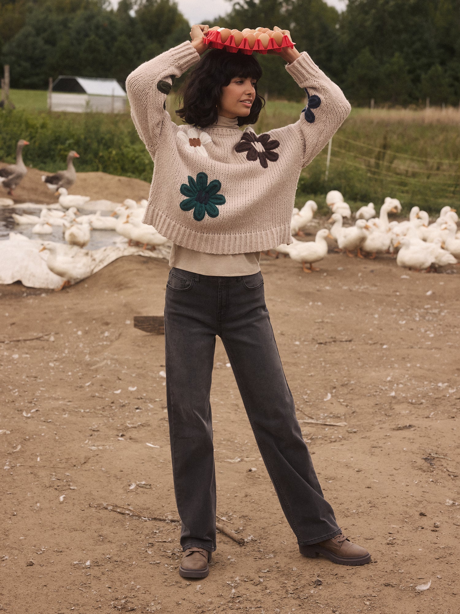 At a Farm with a Knit Sweater on holding eggs