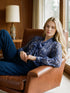 Oceana Printed Pussy Bow Blouse - Woman Wearing V-Neck Long Sleeve Top - Suzy Shier