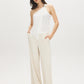 Snow White Asymmetrical One-Shoulder Knit Top - Woman Wearing Sleek Sleeveless Top - Suzy Shier