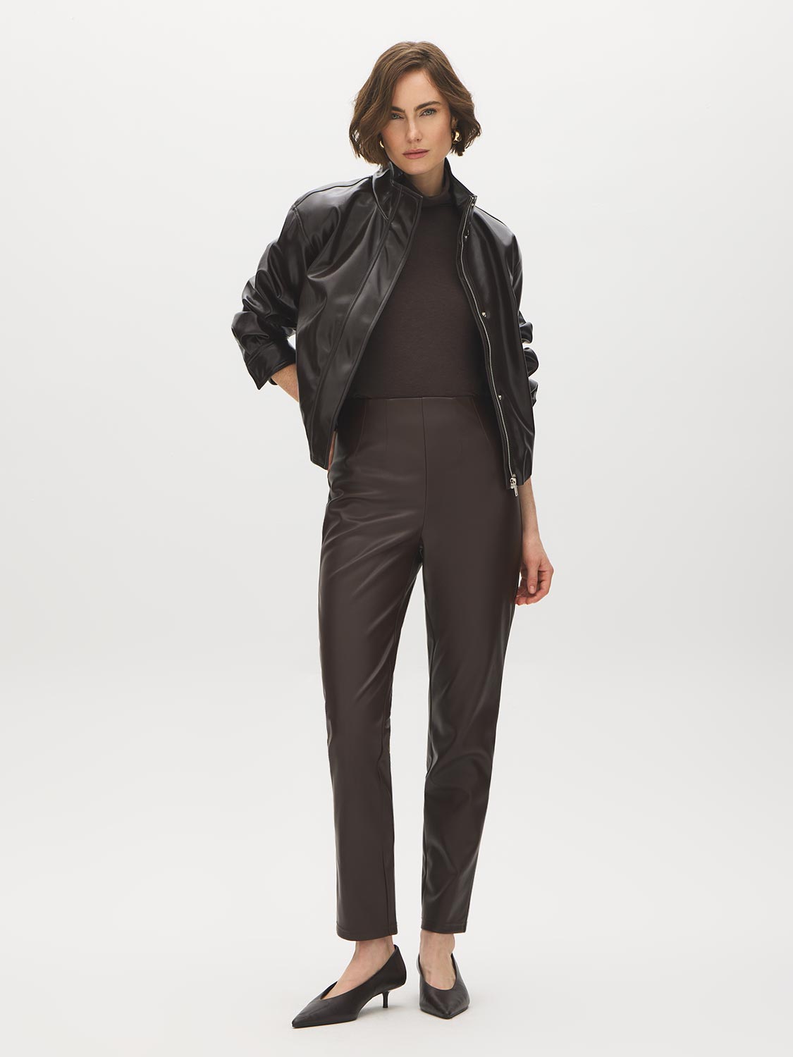 Coffee Bean Faux Leather Slim Leg Pull-On Pant - Woman Wearing Sleek Faux Leather Trousers - Suzy Shier