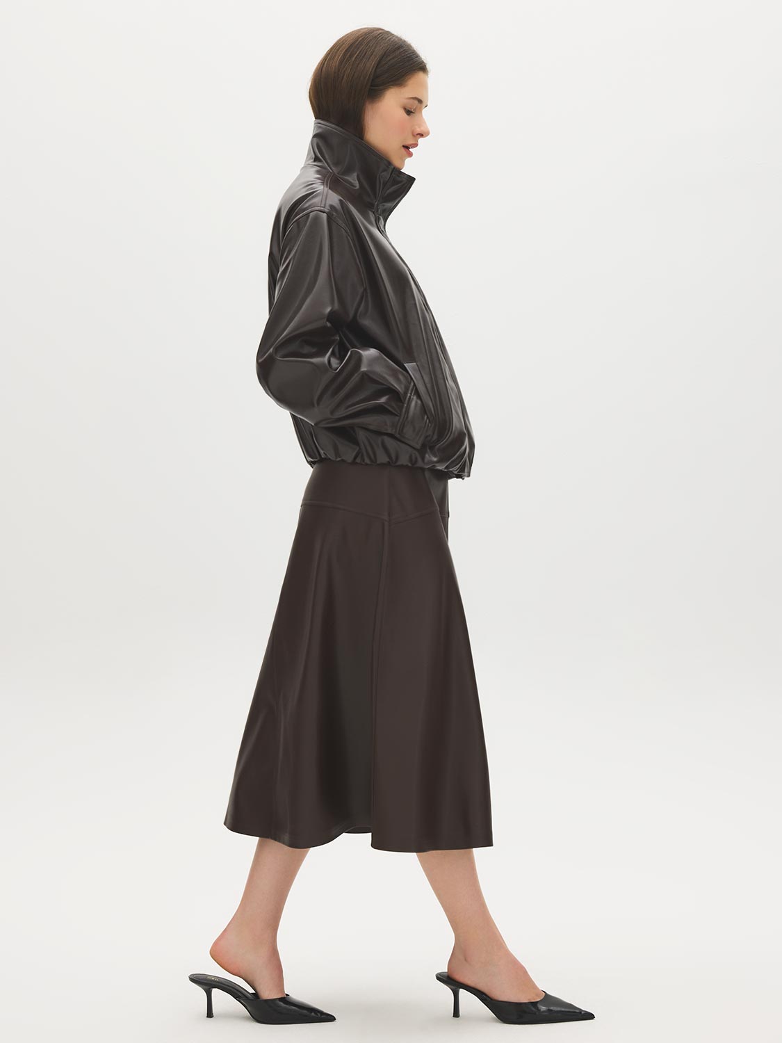 Coffee Bean Faux Leather A-Line Skirt with Yoke - Woman Wearing Structured Skirt - Suzy Shier