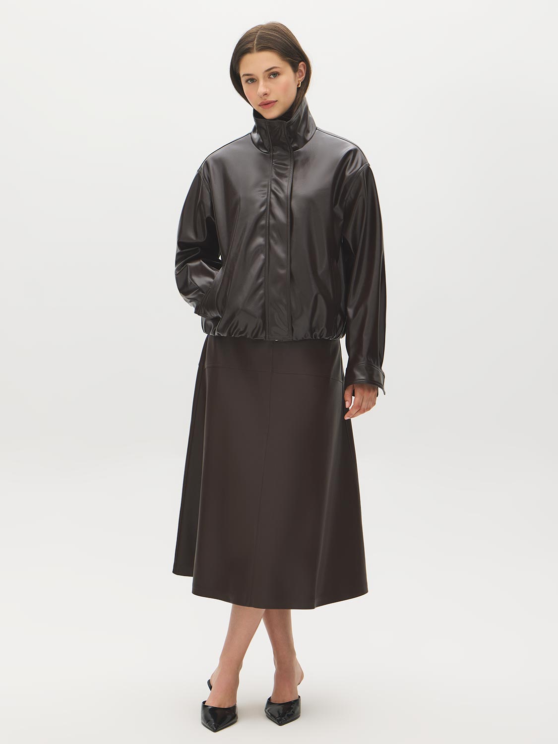 Coffee Bean Faux Leather A-Line Skirt with Yoke - Woman Wearing Structured Skirt - Suzy Shier