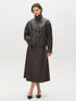 Coffee Bean Faux Leather A-Line Skirt with Yoke - Woman Wearing Structured Skirt - Suzy Shier