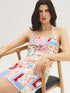 Snow White Conversational Print Halter Mini Dress - Woman Wearing Printed Linen Blend Dress - Suzy Shier