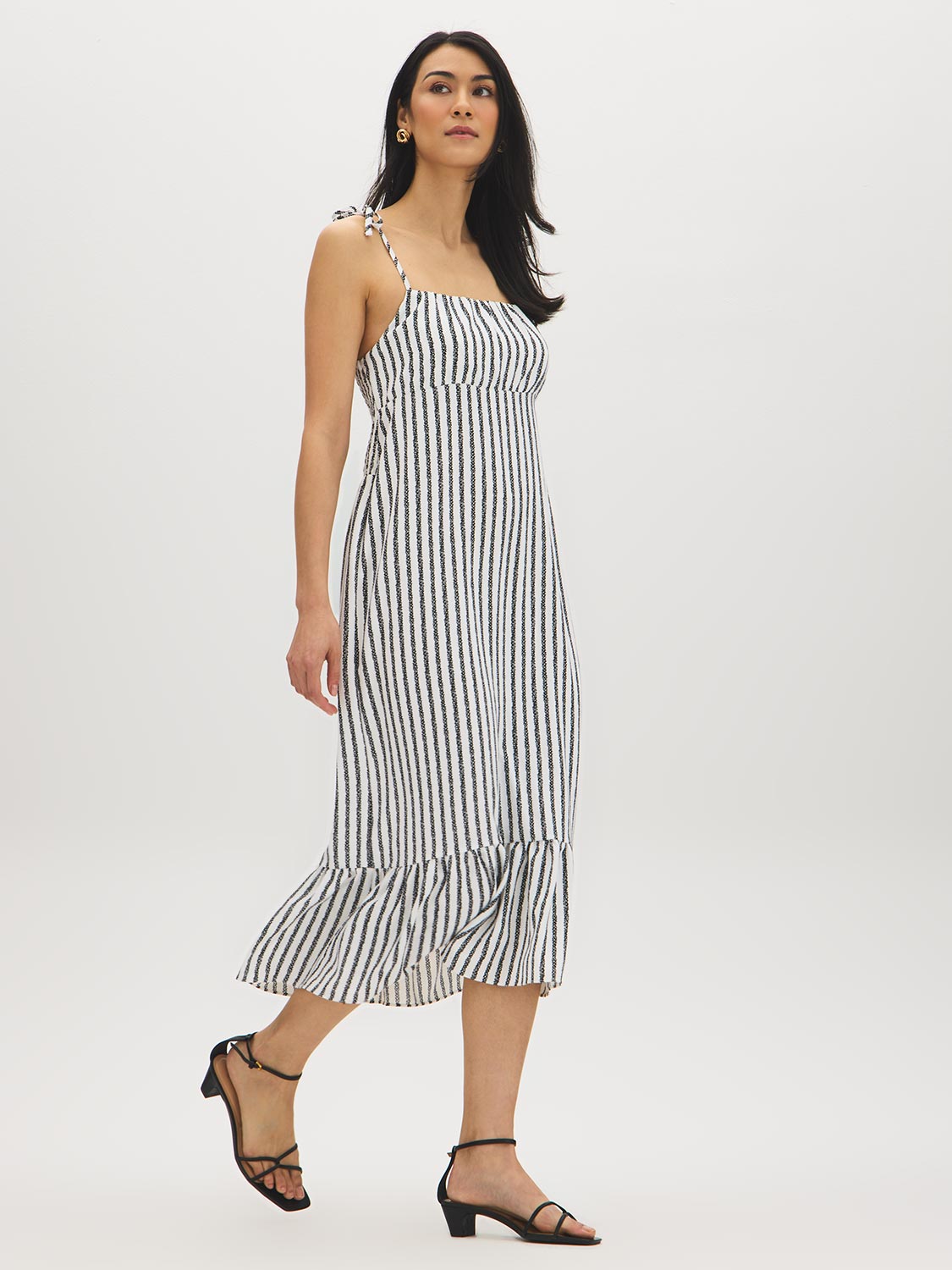Snow White Black Stripe Empire Waist Midi Dress - Woman Wearing Striped Dress with Ruffle Hem - Suzy Shier