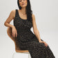 Jet Black Ditsy Print Tiered Dress - Woman Wearing Scoop Neck Dress with Tie Detail - Suzy Shier