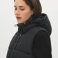 Black Quilted Puffer Vest with Hood - Woman Wearing Water-Resistant Vest - Suzy Shier