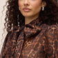 Leopard Print Organza Tie Neck Blouse - Woman Wearing Sheer Animal Print Top - Le Chateau