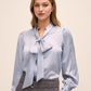 Steel Blue Floral Damask Tie Neck Bow Blouse - Woman Wearing Elegant Woven Top - Le Chateau