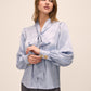 Steel Blue Floral Damask Tie Neck Bow Blouse - Woman Wearing Elegant Woven Top - Le Chateau