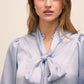 Steel Blue Floral Damask Tie Neck Bow Blouse - Woman Wearing Elegant Woven Top - Le Chateau