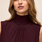 Black Cherry Sleeveless Mesh Gown with Mock Neck - Woman Wearing Elegant Floor-Length Dress - Le Chateau