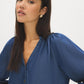Dark Wash Button-Front Tencel Blouse with Balloon Sleeves - Close-up Fabric Detail - Suzy Shier