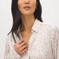 Oat Milk Printed Satin Blouse with V-Neck - Close-up Fabric Detail - Suzy Shier