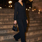 Black Crossover Neck Knit Jumpsuit - Woman Wearing Wide-Leg Evening Jumpsuit - Le Chateau