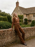 Amber Brown Corduroy Flare Leg Pants - Woman Wearing Mid-Rise Corduroy Trousers - Suzy Shier