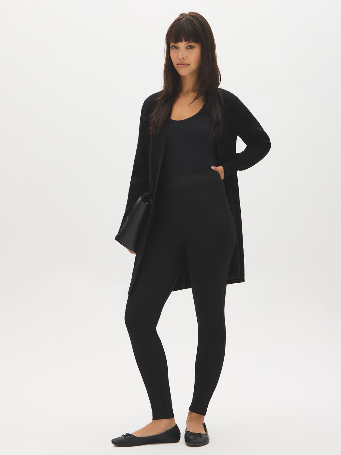Black High-Rise Skinny Knit Pants - Woman Wearing Stretchy High-Waist Trousers - Suzy Shier