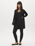Black High-Rise Skinny Knit Pants - Woman Wearing Stretchy High-Waist Trousers - Suzy Shier