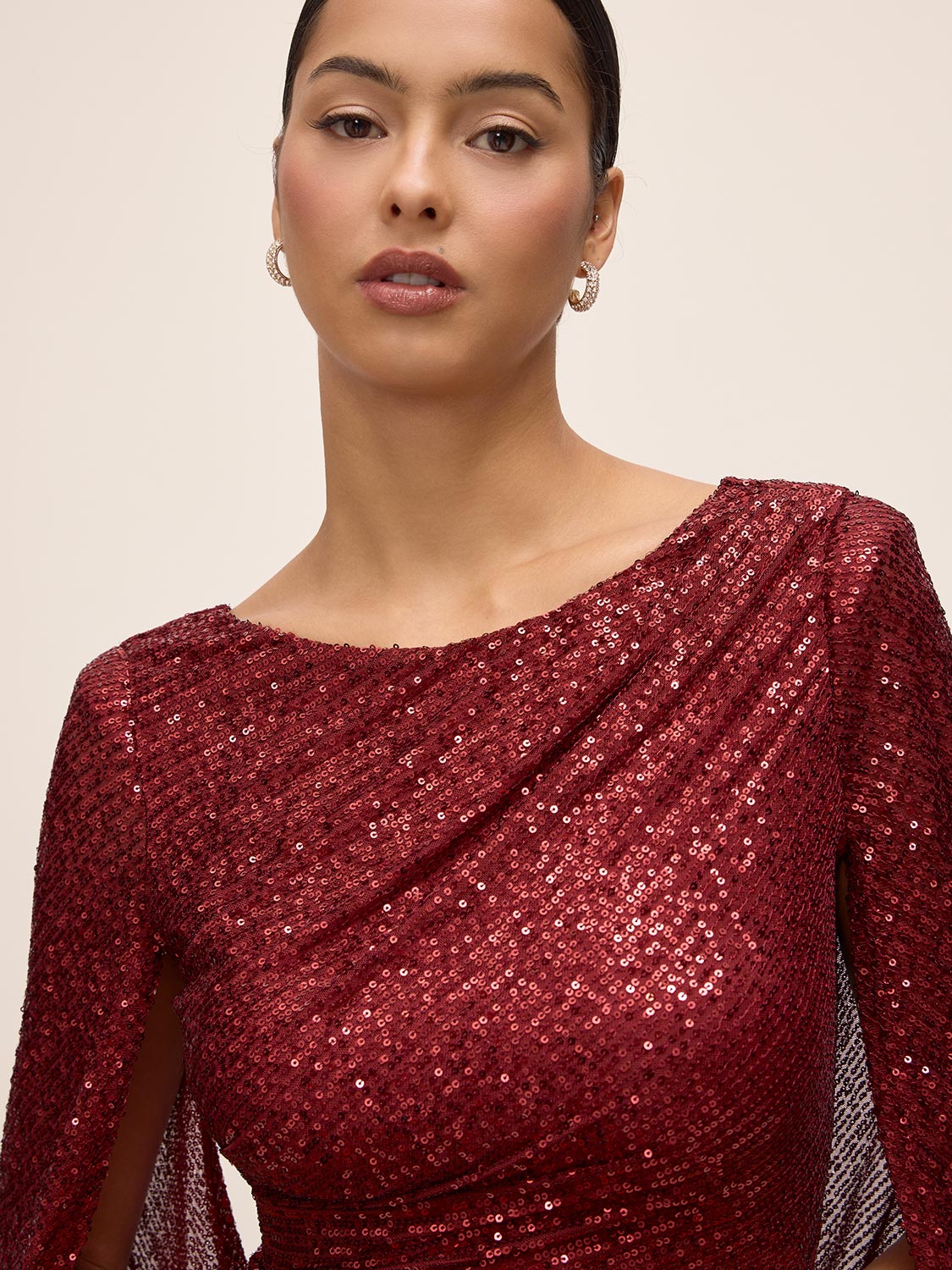 Burgundy Sequin Mesh Gown with Cape - Close-up Fabric Detail - Le Chateau