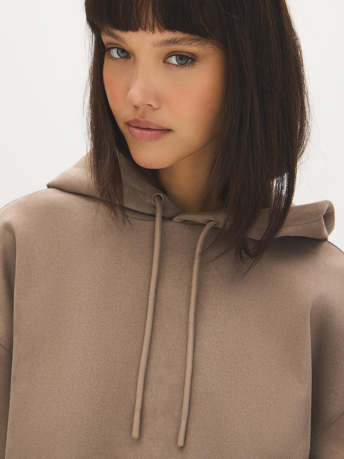 Wood Hooded Faux Suede Sweatshirt with Front Pocket - Close-up Fabric Detail - Suzy Shier