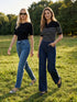 Black/Pearl Striped Ribbed Polo Sweater - Woman Wearing Buttoned Polo Knit Top - Suzy Shier