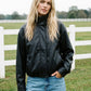 Black Vegan Leather Bomber Jacket with Funnel Neck - Woman Wearing Stylish Outerwear - Suzy Shier