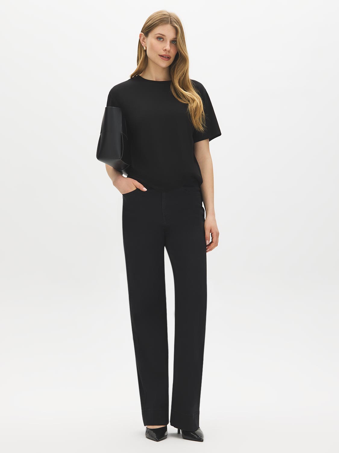Black Wash Straight Leg Denim - Woman Wearing Mid-Rise Jeans with Wide Hem - Suzy Shier