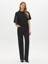 Black Wash Straight Leg Denim - Woman Wearing Mid-Rise Jeans with Wide Hem - Suzy Shier