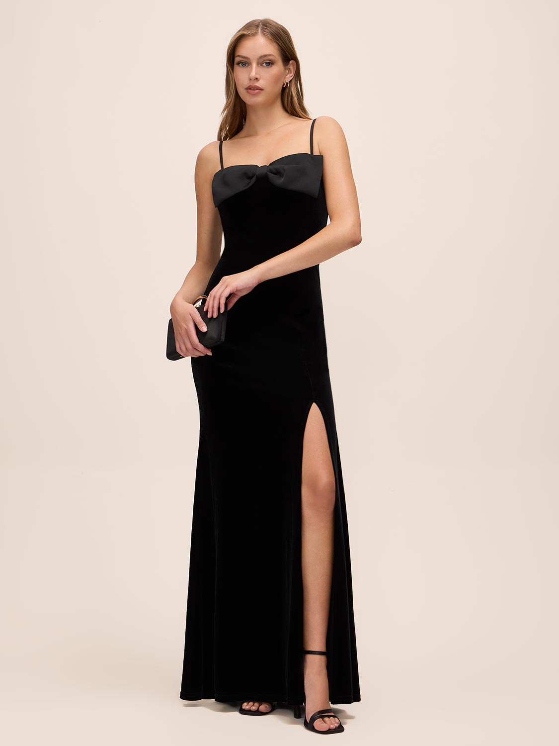 Black Velour Gown with Satin Bow - Woman Wearing Elegant Evening Dress with Front Slit - Le Chateau