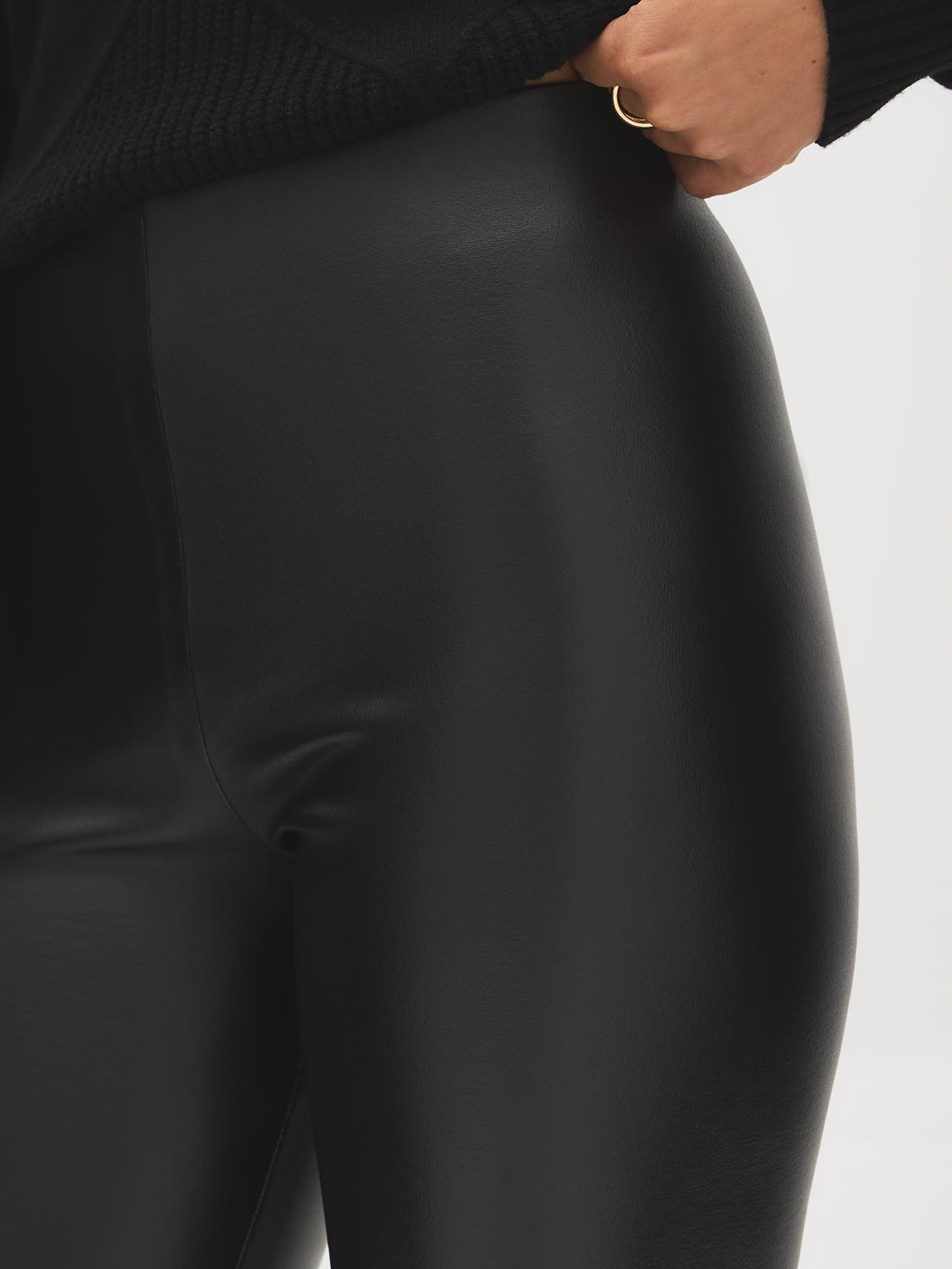 Black Coated Knit High-Rise Skinny Pant - Close-up Fabric Detail - Suzy Shier