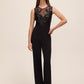 Black Sequin Mesh Illusion Jumpsuit - Woman Wearing Sleeveless Evening Jumpsuit - Le Chateau