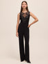 Black Sequin Mesh Illusion Jumpsuit - Woman Wearing Sleeveless Evening Jumpsuit - Le Chateau