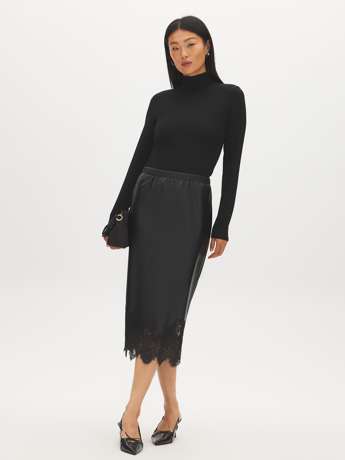 Black Faux Leather Midi Skirt with Lace Hem - Woman Wearing Pull-On Straight Skirt - Suzy Shier