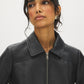 Black Vegan Leather Shorts with Front Zipper - Close-up Collar Detail - Suzy Shier