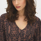 Black Snake Print Balloon Sleeve Top - Close-up Fabric Detail - Suzy Shier