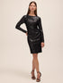 Black Sequin Stripe Scoop Neck Dress - Woman Wearing Long Illusion Sleeve Dress - Le Chateau