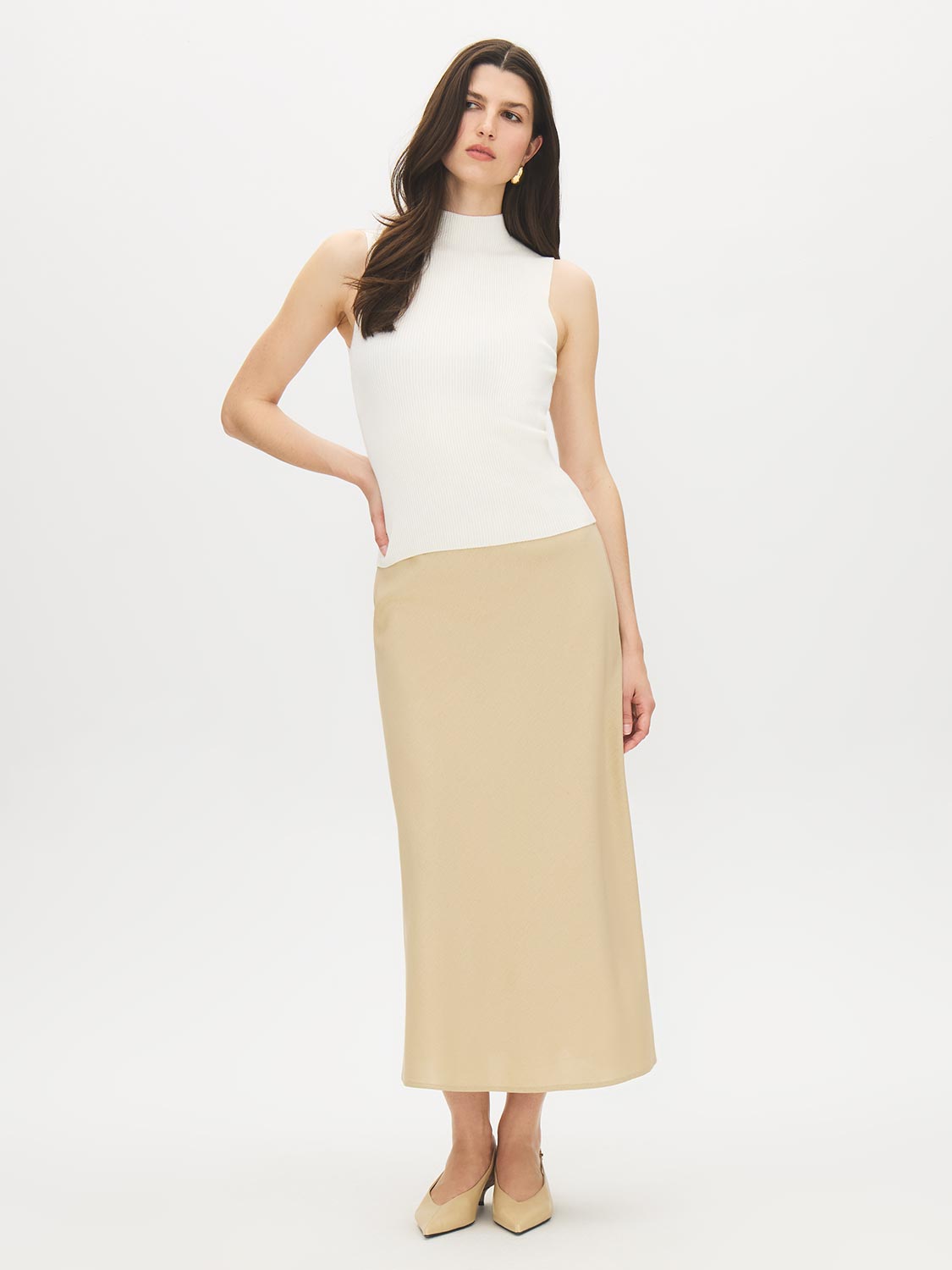 Snow White Sleeveless Rib Knit Sweater - Woman Wearing High Funnel Neck Top - Suzy Shier