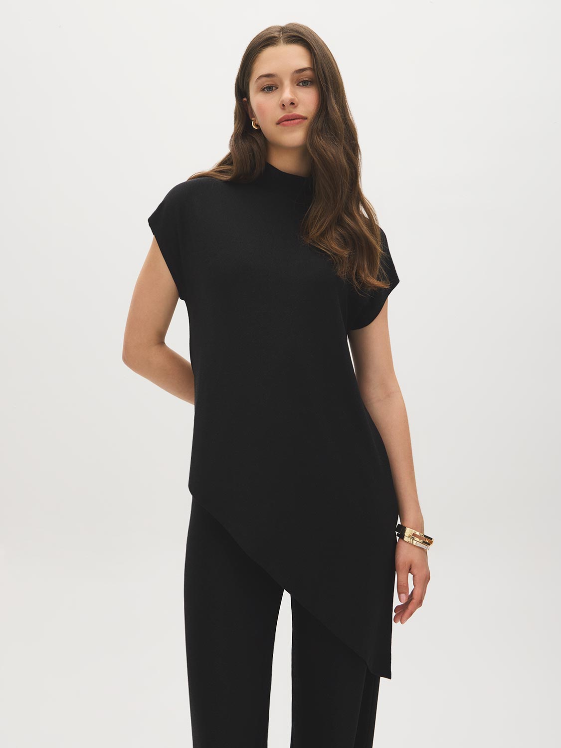 Black Mock Neck Shimmer Asymmetrical Top - Woman Wearing Sleeveless Knit Top - Suzy Shier