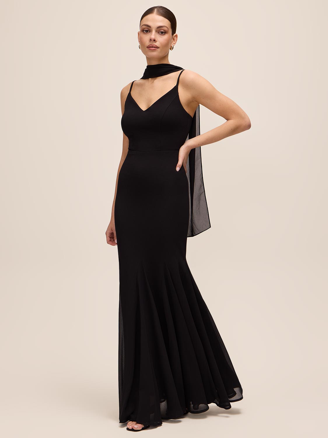 Black Knit Crepe Gown with Chiffon Godet Inserts - Woman Wearing Elegant Evening Dress with Scarf - Le Chateau