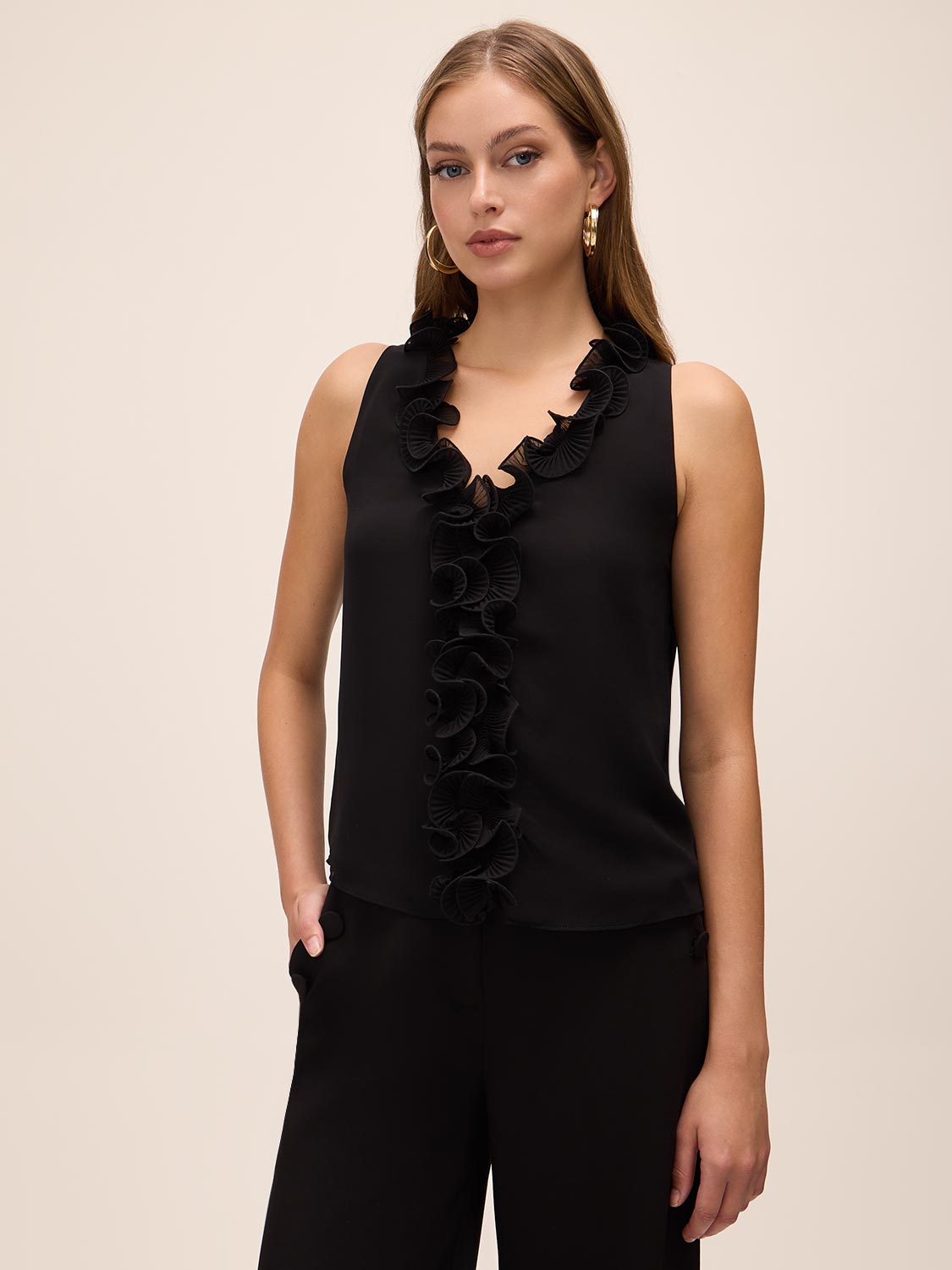 Black Plissé Ruffle Sleeveless Blouse - Woman Wearing Textured Blouse with Cascading Ruffles - Le Chateau