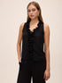 Black Plissé Ruffle Sleeveless Blouse - Woman Wearing Textured Blouse with Cascading Ruffles - Le Chateau