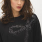 Jet Black Sequin Bow Detail Knit Top - Close-up Sequin Detail - Suzy Shier