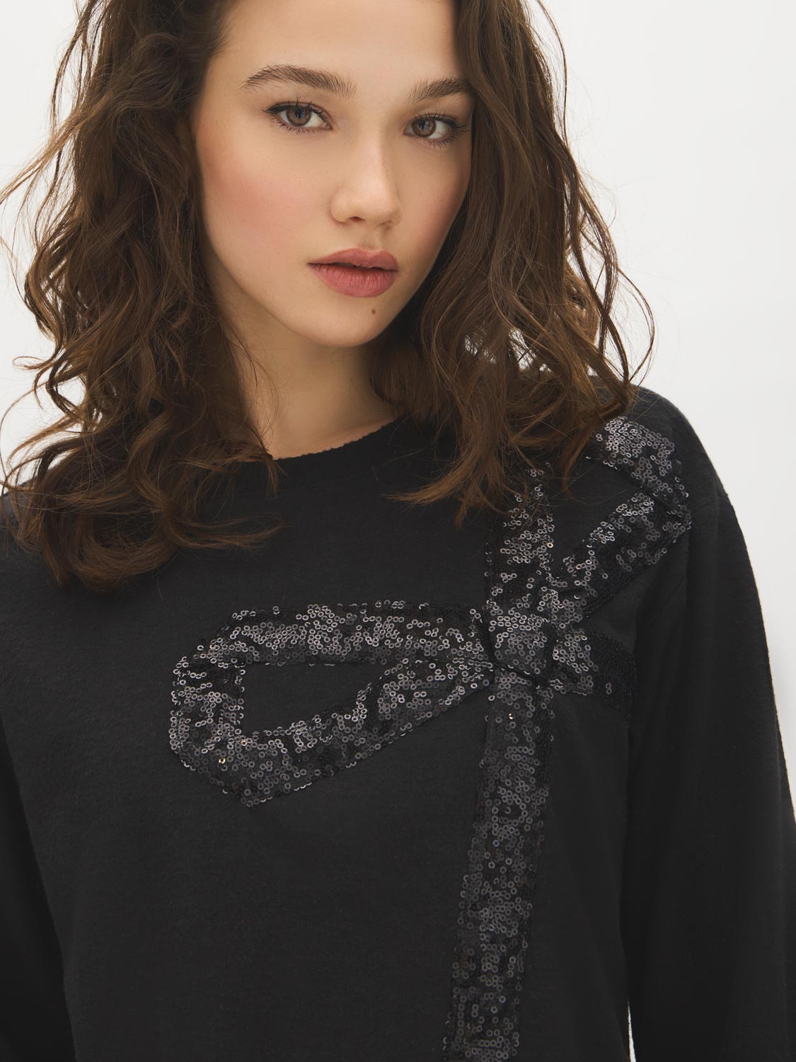 Jet Black Sequin Bow Detail Knit Top - Close-up Sequin Detail - Suzy Shier