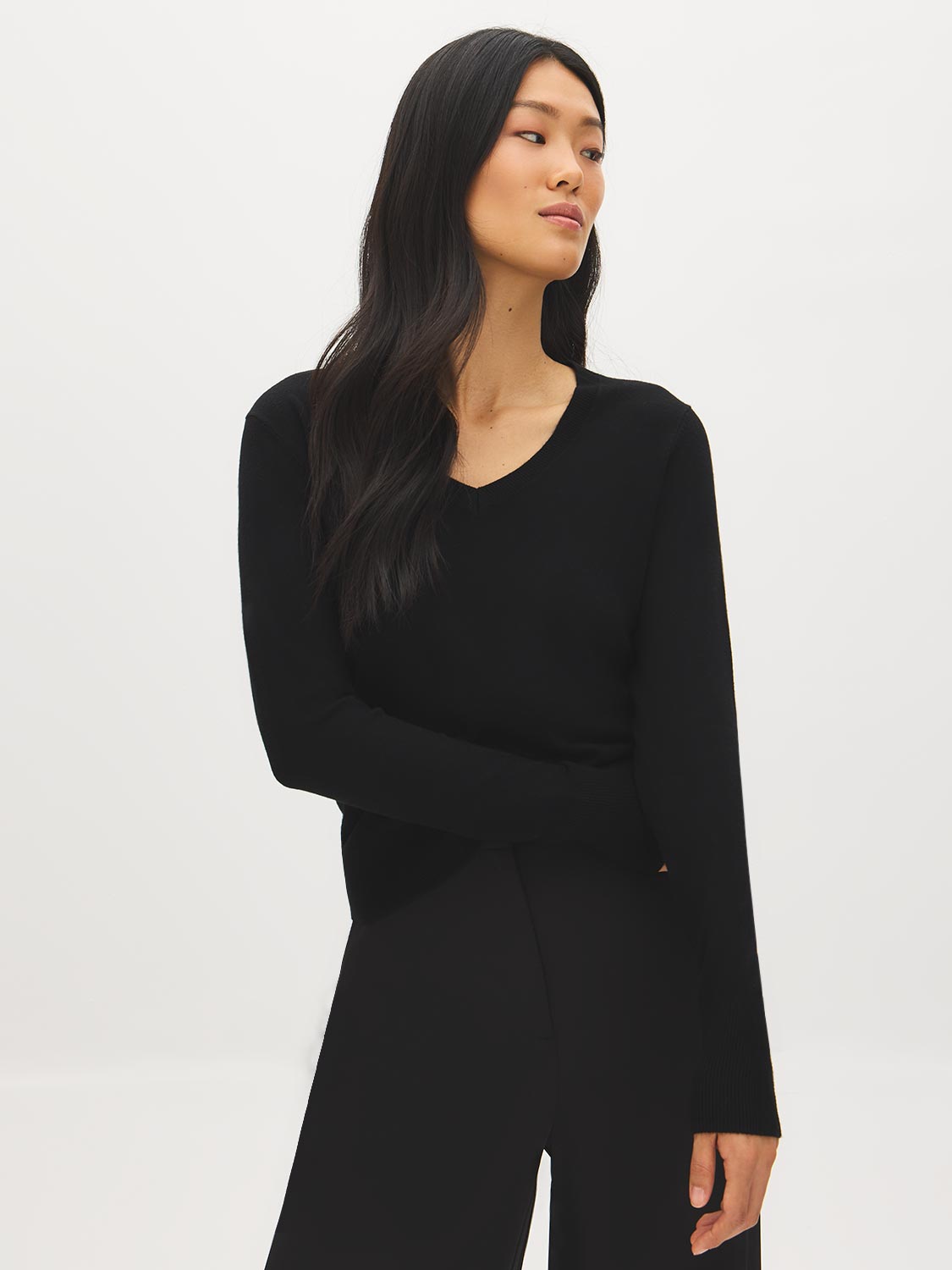 Black V-Neck Knit Sweater with Ribbed Cuffs - Woman Wearing Soft Knit Top - Suzy Shier