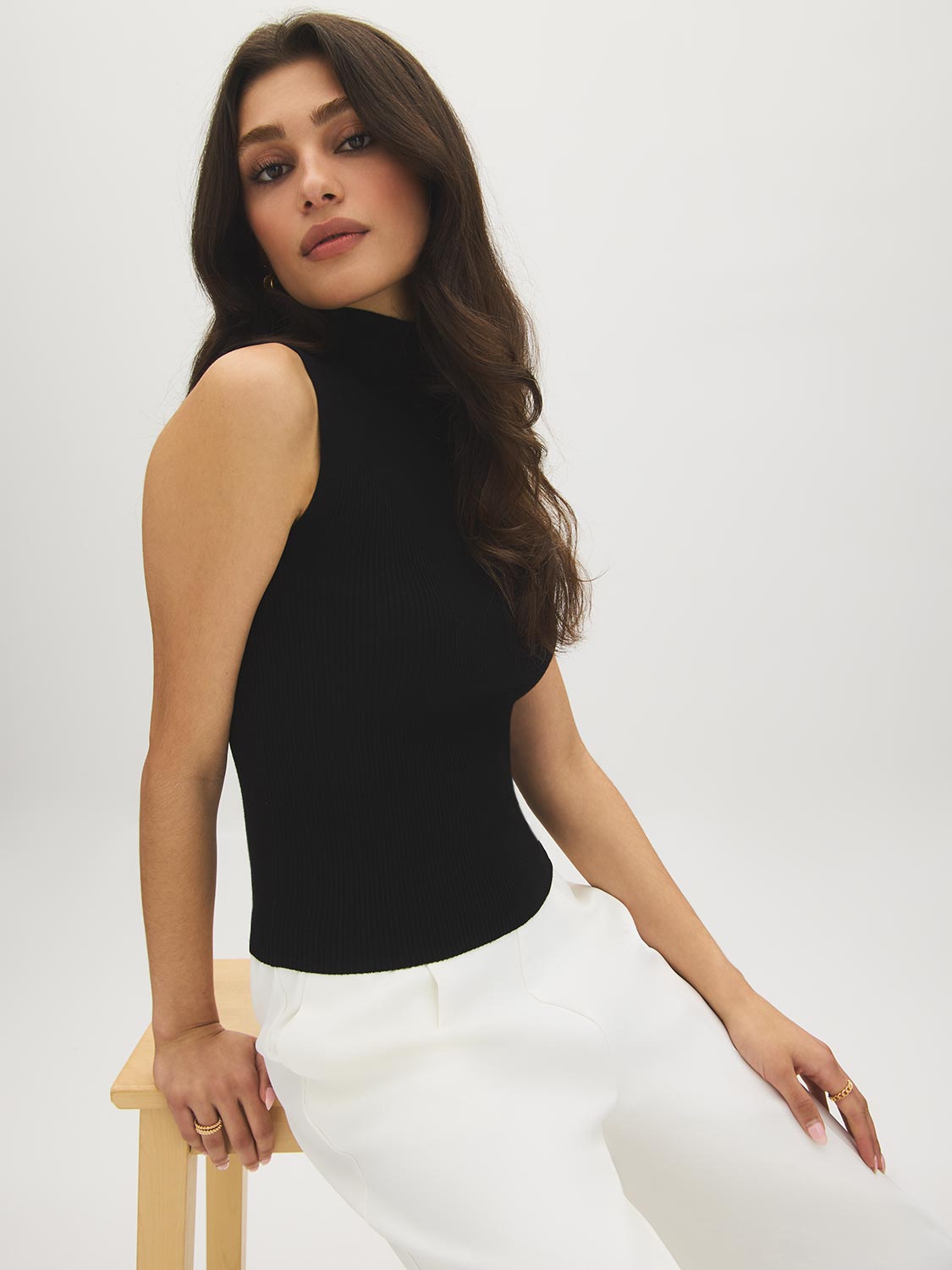 Black Sleeveless Ribbed Funnel Neck Sweater - Side Profile View - Suzy Shier