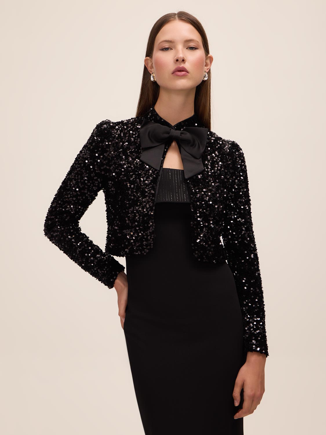 Black and Antique Cream Sequin Bolero with Puffy Sleeves - Woman Wearing Evening Cover-Up with Removable Bow - Le Chateau