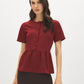 Syrah Button Front Peplum Crepe Top - Woman Wearing Short Sleeve Knit Top - Suzy Shier