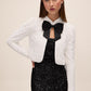 Black and Antique Cream Sequin Bolero with Puffy Sleeves - Front View with Bow - Le Chateau