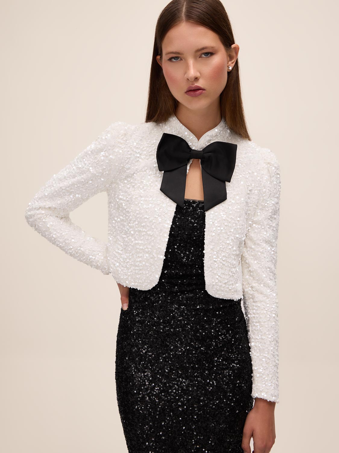 Black and Antique Cream Sequin Bolero with Puffy Sleeves - Front View with Bow - Le Chateau